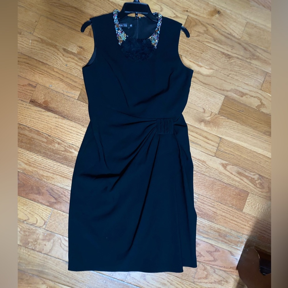 Black sleeveless midi dress.